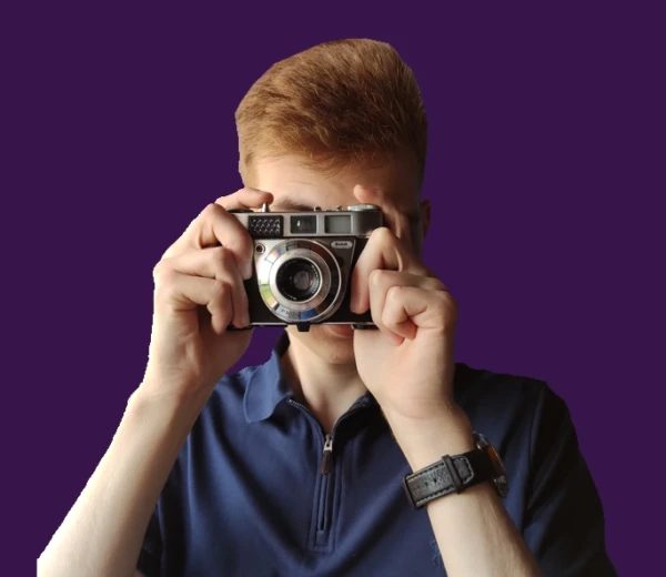 Image of Rafał Tomczyk holding digital camera